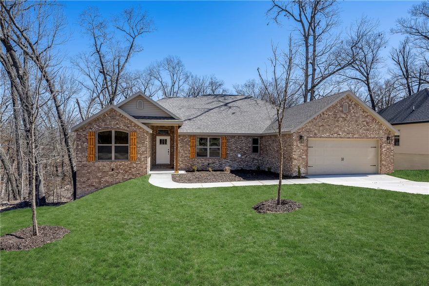 Brand new Bella Vista Beauty sitting on a .3acre lot! 2 bedroom + flex room/2 bath home featuring the builders most popular plan including an open concept with split bedrooms. Boasting lots of natural light, high-end quality finishes: hardwood floors in living and dining area, gas log fireplace, granite countertops, pantry & custom cabinets. Spacious primary suite has a spa like bath with double vanities, custom tile shower & separate free-standing tub. Primary closet connects to laundry room. Enjoy time on the covered deck that overlooks nature. Generac transfer switch already installed. ($1k value) $0 down payment, 100% financing, rural development loan available. $5000 towards rate buy down or closing costs with builders preferred lenders.