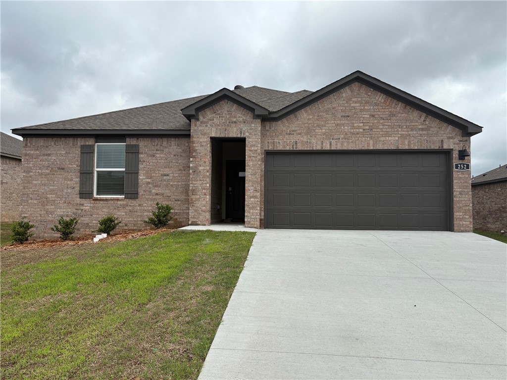 Beautiful Bellvue Plan in Wagon Wheel Phase 2, in Farmington, Arkansas! Each home in Wagon Wheel is meticulously crafted with attention to detail, creating a space that feels both luxurious and welcoming. From the moment you walk through the door, you'll be greeted by modern features and spacious a layout that caters to every lifestyle. Our homes boast premium finishes and thoughtful designs, ensuring that you'll be stepping inside your own personal oasis. These homes will be complete with LVP flooring throughout and wood shelving in all closets, pantry and utility room. The kitchen will have quartz kitchen counters, 36-inch cabinets, and stainless-steel appliances! Home will have a Garage Door Opener. Primary bath will have quartz countertops, double sinks, and an oversized walk-in shower. Each home comes with 4-sided brick with Hardie ® per plan. Taxes and Parcel TBD.