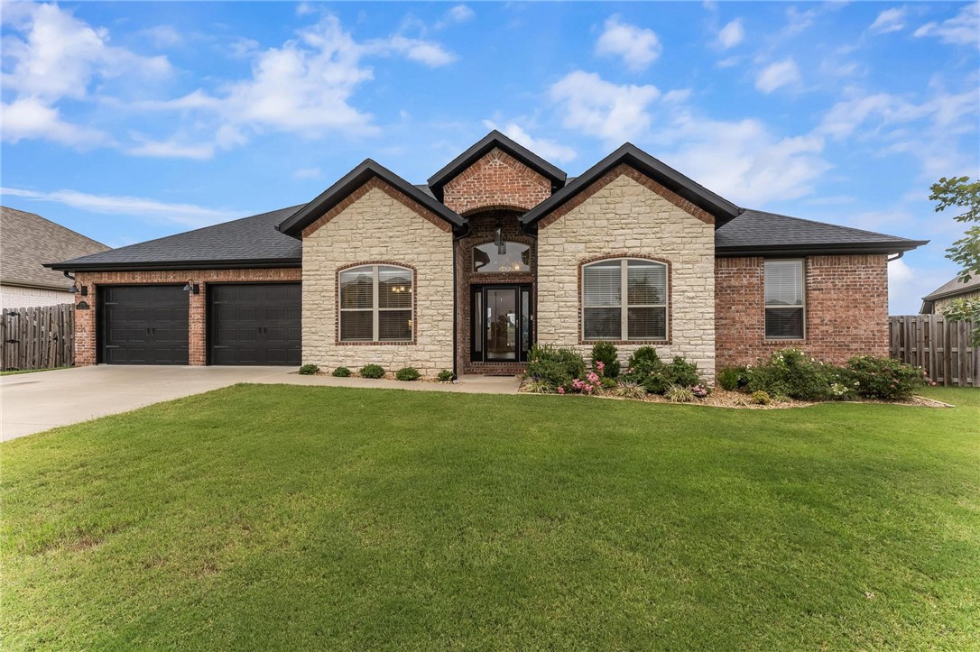 Welcome to 1770 Sunrise Cirlce. . . a meticulously cared for brick & stone 4-bed, 2-bath, split floor plan home located on a large level lot in a quiet subdivision. Walking distance to Centerton Gamble Elementary & 1 mile to Bentonville West High School. The kitchen features granite counter tops, stainless steel appliances, tons of cabinets and an eat-in kitchen space overlooking the backyard. Living space is open to the kitchen and flows perfectly for everyday living or entertaining with direct access to the patio. Dining room is located at the front of the house with flexibility to be used as an office or a family room. Ceramic wood-appearance tile floors flow throughout the main living space with carpet in the bedrooms. Primary suite includes a beautiful, over-sized tiled shower, walk-in closet and dual vanity. The level backyard features a covered patio, gas fireplace, wood privacy fence & plenty of space to customize as you wish. Convenient access to both Bentonville & Bella Vista with just 4 miles to I-49.