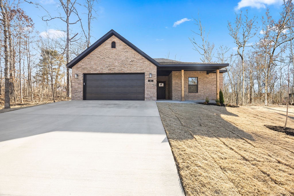 Come enjoy Bella Vista and all of its beautiful amenities in a NEW home. Nice sized lot in a peaceful wooded neighborhood. World class mountain biking on The Back 40 trail system in your backyard. Just a half mile to jump on Summit School Trail. Home's interior features an open layout with a large granite island, stainless steel appliances, and a pantry. LVP flooring throughout. Dedicated laundry room. Hot Water recirculation system. Covered deck overlooking the backyard's beautiful view. Builder offers a TWO YEAR warranty. Fantastic location in Bentonville schools. Easy access to Lake Ann Boat Launch. *All photos - interior and exterior - are of a previous home built with the same layout and similar finishes.* Ask about other Bella Vista locations coming up!