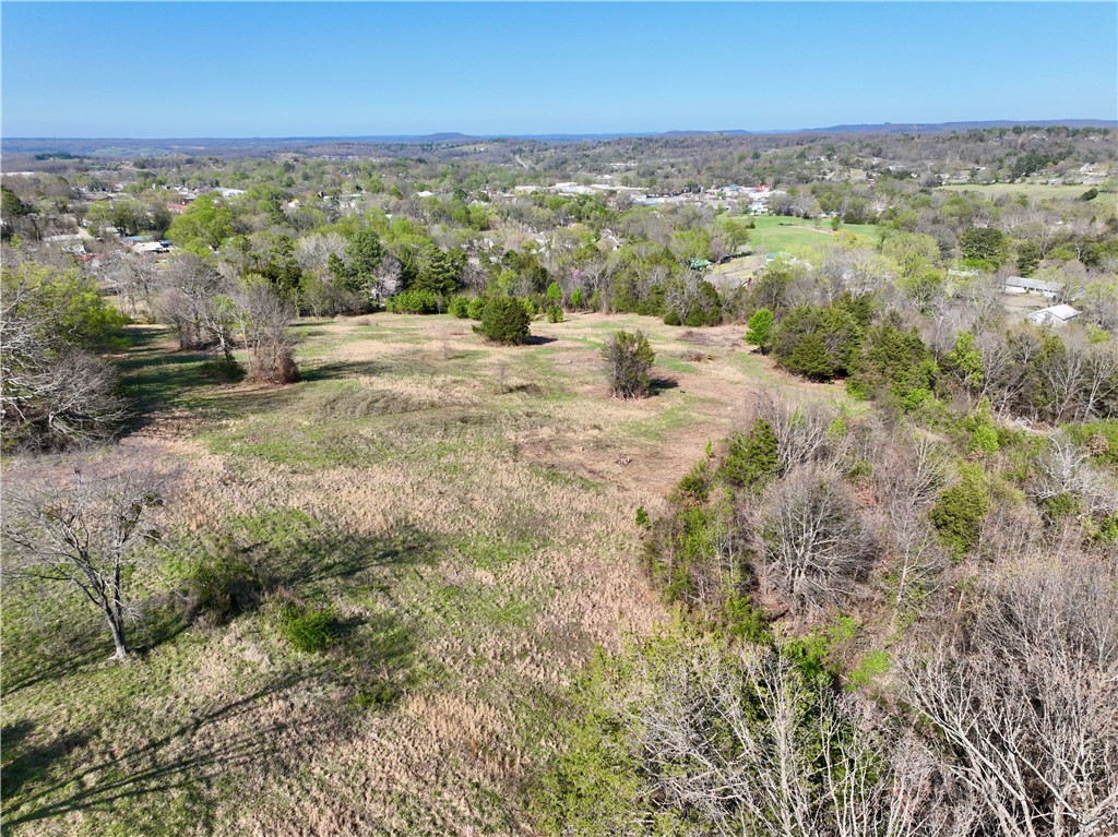 Discover a rare opportunity to own an incredible piece of land on the outskirts of Huntsville, offering unparalleled panoramic views of the surrounding landscape. This stunning tract of land is perfectly situated with easy paved road access, ensuring both convenience and seclusion for your dream home or investment property. With numerous buildable locations, this property provides the flexibility to design and construct a home that maximizes its breathtaking scenery.