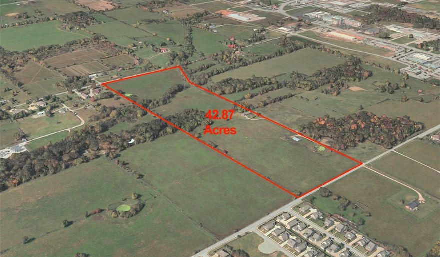 Located in one the hottest areas of NWA, this 42.87 acre tract is located between Rainbow & Dodson with access off both. With an amazing location close to retail, restaurants, shopping, industry and the NWA Razorback greenway, w/ all utilities available & a level topography, this parcel offers endless development potential. With road improvements already planned creating multiple hard corners, this piece will have easy ingress and egress to I-49, Rogers, & Bentonville.