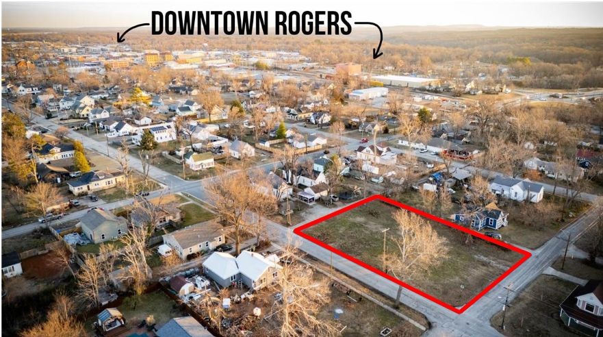 This premium and spacious corner lot in the heart of Downtown Rogers offers a fantastic opportunity. With its prime location, it's ready for a custom build or offers the potential to split and develop into a more ambitious project. Whether you're looking to build a single-family home with easy access to all the city offers or pursue a development, this lot is a blank canvas in a highly sought-after area.
