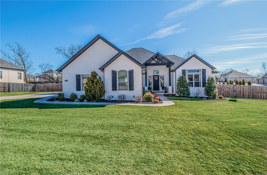 Welcome to this meticulously maintained, one-owner brick home, featuring 4 bedrooms and 3.5 bathrooms, situated on a large corner lot. The open floor plan showcases a chef’s dream kitchen, a spacious main-level master suite, and a luxurious master bath with his-and-her closets. One of the main-level bedrooms is perfect for an office, while the upstairs bonus room, complete with a full bath, offers endless possibilities—whether as a playroom, gym, office, or extra bedroom. Step outside to enjoy the ultimate in outdoor living, with a stunning inground pool, outdoor kitchen, and a covered patio with a wood-burning fireplace. The 3-car garage and walk-in attic provide ample storage space. Don’t miss out on this fantastic opportunity to own a home that combines style with versatility!