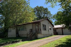 Good neighborhood for this solid house that needs painting and flooring. New HVAC & roof added in 2009. Storm windows and pantry. Add a stackable washer/dryer in the large laundry room & then convert to dining room, computer room or add a day bed for extra bdrm. Nice, private back yard. Detached garage with opener and workshop. Perfect for first time homebuyers or rental and close to Forest Heights School. House has asphalt shingles & garage has metal roof.