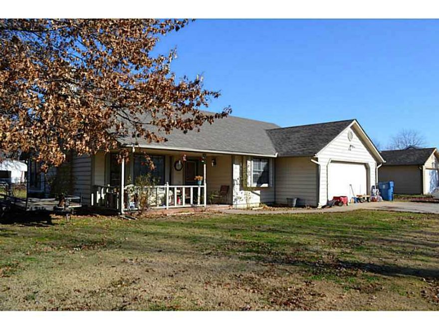 Nice open floor plan with fireplace, remodeled kitchen with tile floor, backsplash & very nice countertops, new carpet and freshly painted. Roof is 3 years old.  Large fenced in back yard and on a corner lot.  It's a must see.