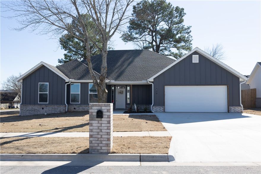 Beautiful Move in Ready Home in Wakefield Park Community! This 2024 Built home features a bright and spacious living area, 4 bedrooms, all appliances, and luxury vinyl plank floors throughout. Large foyer entry welcomes you into the home with coat closet for added storage. The living room has large windows looking into the backyard, a beautiful fireplace as focal feature and vaulted and beamed ceilings. The eat in kitchen is an amazing workspace, with gas cooktop, large pantry, island with counter seating and more! Set dining space off kitchen is an inviting and bright room. Primary Bedroom has large, attached bath with shower and dual sink vanity as well as a WIC. Split floorplan has 3 additional bedrooms on other side of home with 2 full guest baths. Covered patio is perfect outdoor living space to enjoy your fully wood fenced yard. Located in quiet neighborhood near park, schools, and easy access to University of Arkansas and Fayetteville! Welcome Home!