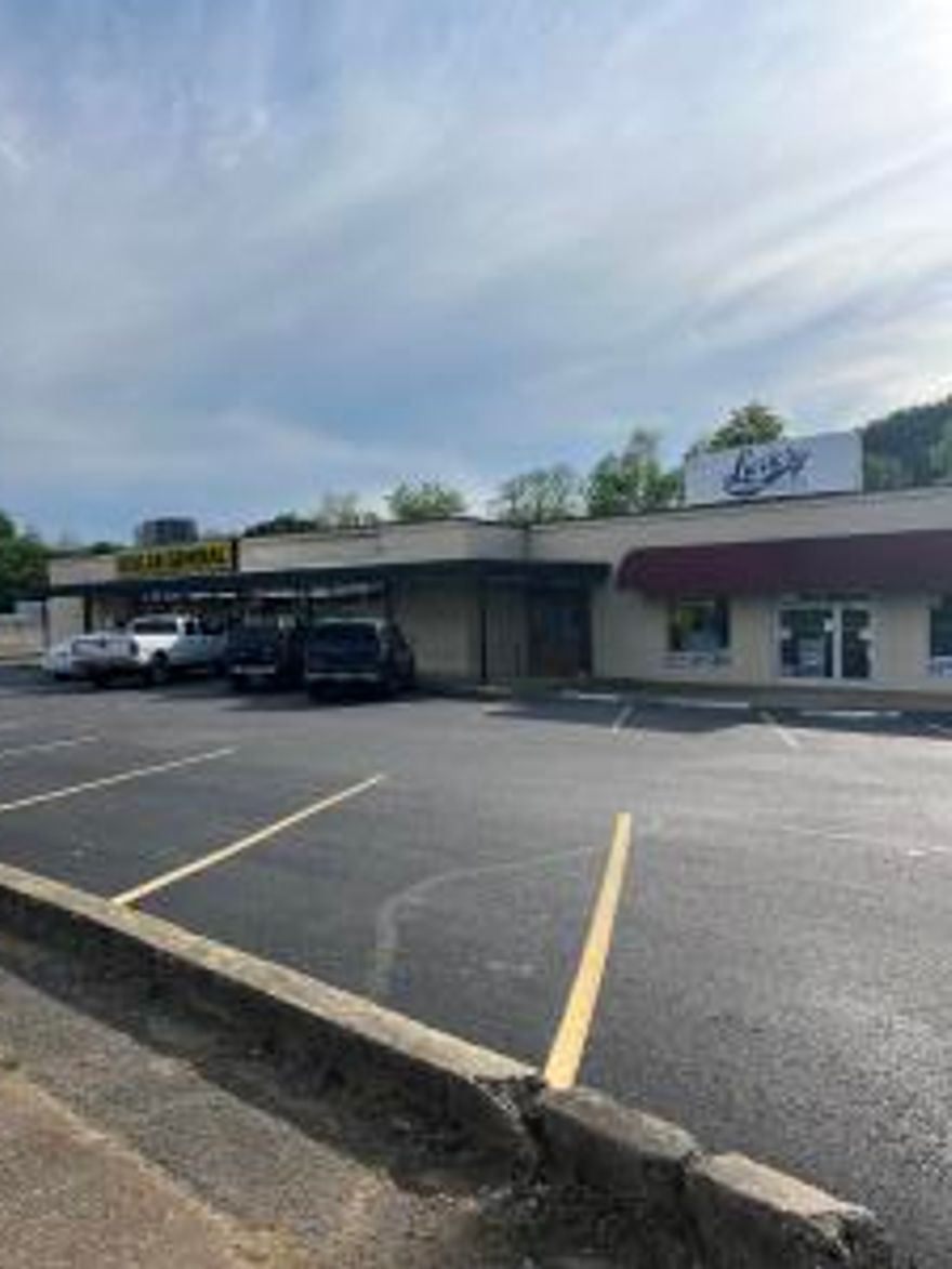 Location, Location, Location. Property sits 4 blocks from the center or Russellville with 2 good stable tenants already in place.  Come take a look at this income producing property. NEW FRESH COAT OF EXTERIOR PAINT.  11/1/24