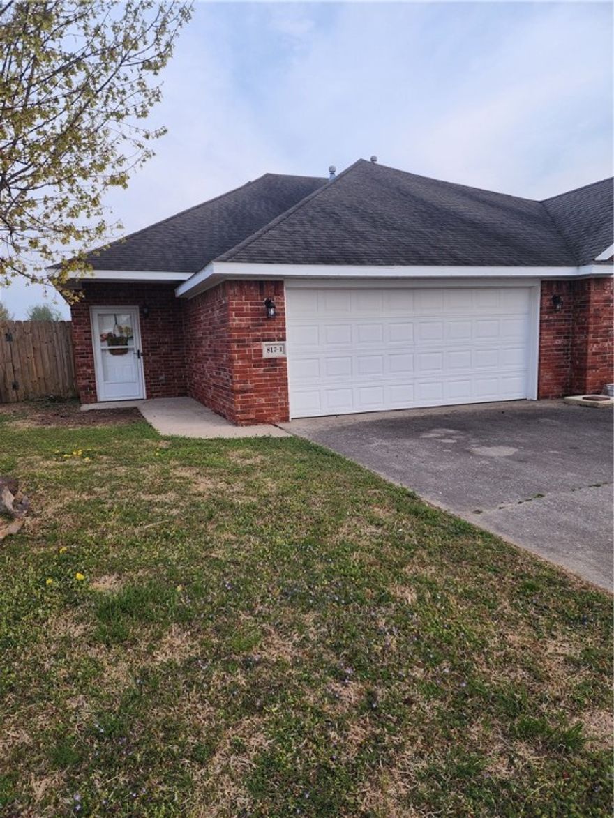 Left side of duplex. only 1 block from Hwy 62. All ceramic floors, well kept .  Two car garage also. List price only $161.45 per sq ft. A great buy, close to gas/food, banking, short distance to shopping. Mst bath is adapted for handicap access to shower. All on 1 level.