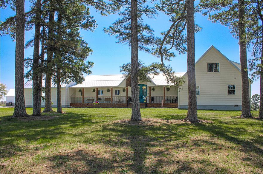 Welcome to your dream 5-bedroom, 3,864 sq ft home featuring an open floor plan, spacious bonus room, and wood flooring. The main bedroom offers a large walk-in closet. Enjoy relaxing on beautiful porches or by the swimming pool. Amassive 4,200 sq ft garage includes a bathroom, perfect for extra storage or hobbies. Set on a flat land with a pond, this property blends comfort, space and tranquility ideal for peaceful living or entertaining guests.