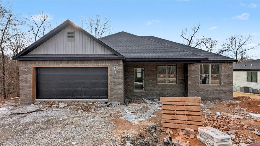 Welcome To Your Next Home! Here We Go Again Offering Up A Fab New Build - 4 Bedroom, Split Floorplan, Vaulted Ceiling In The Living With Beam Accents, Primary Suite w/ Dual Vanity, Potty Closet, Walk-in Closet, Full Custom Tile Shower In Primary Bath. 9 Foot Ceilings In All Not Vaulted Areas. Storage Galore! Kitchen Offers Pantry, Tile Backsplash, Under Cab Lighting, Bar/Island, Eat-in Dining. Custom Cabinets And 3cm Quartz Throughout. MTB Trails Closeby. Bentonville Schools. Grab It Now And Make Selections To Fit Your Style! Wrapping Up Feb 2026.