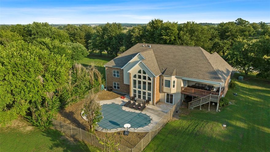 Too late in the summer to buy a new home w/a pool? I think not! Dive right in & finish the summer out right w/your new inground pool! This home offers 3828 ft.² spread across two levels & sits on a 1.06ac lot. The main level offers an open floor plan w/a large entry that opens up to the living & dining rooms. The large kitchen has plenty of storage & all stainless steel appliances. The living room is completed w/a gas fireplace, floating shelves, & a wall of windows letting in a ton of natural light. The large master bedroom overlooks the pool & has an en-suite w/a double vanity, walk-in shower, & whirlpool tub. There are two more large bedrooms upstairs & another full bath. Downstairs has a 2nd living room, another large bedroom, workout room w/lots of storage, & a game room w/your very own pool table! Outback is your 12ft deep gunite pool wrapped w/cool decking & a diving board! After you get done swimming, grab your fishing pole & head to the fully stocked community pond & catch yourself a big ol' catfish!