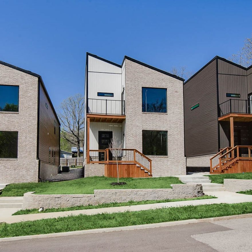 Experience the height of modern luxury in this beautifully designed urban retreat. Blending contemporary style with thoughtful functionality, this home features an open-concept filled with natural light from expansive windows, creating a bright and welcoming ambiance. The kitchen is a true centerpiece, complete with quartz countertops, custom cabinetry, and stainless steel appliances—perfect for both entertaining and everyday living. Flowing effortlessly into the spacious living areas, it sets the stage for cozy family dinners. Upstairs, the primary suite offers a peaceful escape with vaulted ceilings, a private balcony, and a sleek en-suite bathroom with a stunning tiled shower. Additional bedrooms also feature vaulted ceilings and share a second bathroom finished with modern touches. Step outside to a large rear balcony, ideal for outdoor entertaining or unwinding under the stars. Situated just 2 miles from the lively Dickson Street and Fayetteville Square, you’ll enjoy quick access to top dining and shopping.