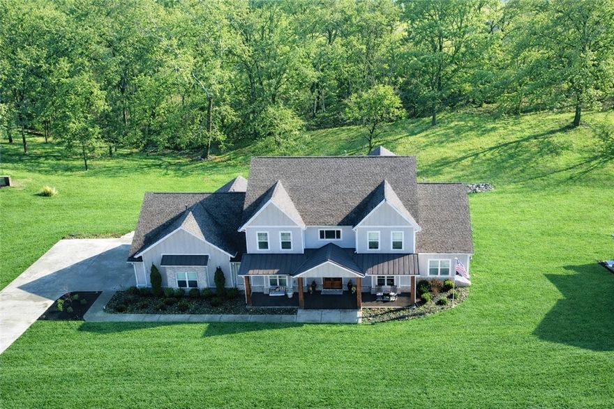 Rare opportunity to own a beautiful 2022-built home on 1.28 acres in The Meadows at Little Flock. Offering approximately 4,608 sq ft, this 5-bedroom, 5-bath home features a flexible layout ideal for both everyday living and entertaining. The main level includes a spacious primary suite plus an additional bedroom with private bath, perfect for guests or multigenerational living, along with a library/office, dining area, and an inviting living area with fireplace. The kitchen features granite countertops, custom cabinetry, pantry, and Energy Star appliances. Upstairs offers additional bedrooms, and flex spaces for recreation, fitness, or media. Enjoy outdoor living on the covered deck with low-maintenance composite decking overlooking the landscaped yard with irrigation system. 3-car attached garage provides exceptional storage and workspace. Convenient Rogers School District location just minutes from shopping, dining, and everyday amenities.  OPEN HOUSE Sunday March 8th 1:00 PM to 3:00 PM.  Showings start FR.