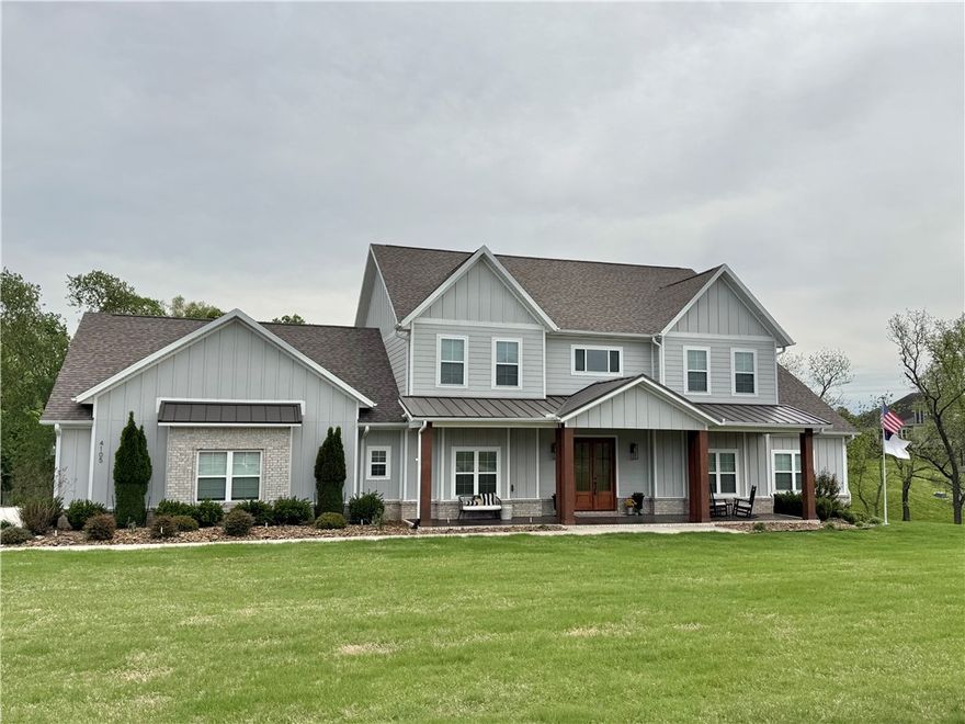 Beautiful 2022-built home on 1.28 acres in The Meadows at Little Flock. Offering approx. 4,608 sq ft, this 5-bedroom, 5-bath home features a flexible layout ideal for everyday living and entertaining. The main level includes a spacious primary suite plus an additional bedroom with private bath—perfect for guests or multigenerational living—along with a library/office, dining area, and inviting living room with fireplace. The kitchen offers granite countertops, custom cabinetry, pantry, and Energy Star appliances. Upstairs includes additional bedrooms and flexible spaces for recreation, fitness, or media. Enjoy outdoor living on the covered composite deck overlooking the landscaped yard with irrigation. 3-car garage. Located in Rogers School District with Bentonville School Choice options (buyer to verify).  Some photos include AI-generated pool renderings; no pool currently exists.