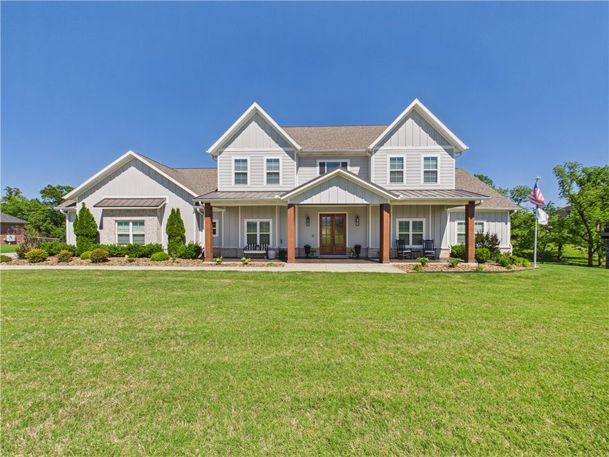 Rare opportunity to own a newer home on 1.28 acres less than 5 miles from both Downtown Bentonville and Downtown Rogers. This 2022-built home offers approx. 4,608 sq ft with 5 bedrooms and 5 baths, combining space, flexibility, and convenience in one of Northwest Arkansas’ most desirable areas. The main level features a spacious primary suite plus a private guest suite, dedicated office, dining area, and inviting living room with fireplace. The kitchen offers granite countertops, custom cabinetry, pantry, and Energy Star appliances. Upstairs includes additional bedrooms along with flexible space for media, fitness, or recreation. Enjoy the covered composite deck overlooking the irrigated yard with pool-ready utilities already in place. 3-car garage. Rogers Schools with Bentonville School Choice opportunities (buyer to verify).