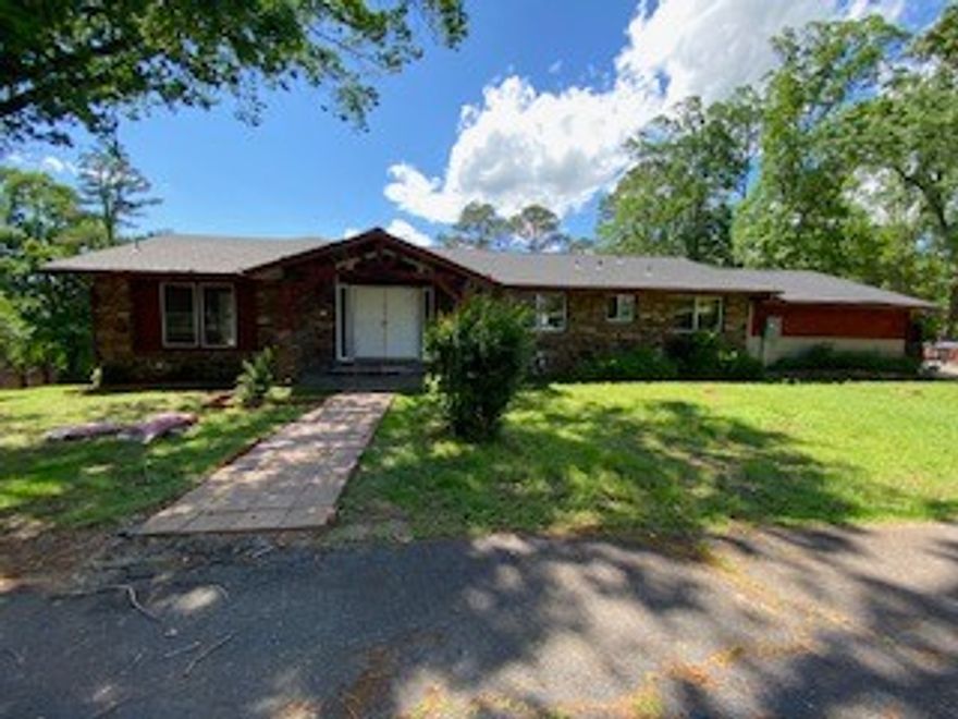 Executive Home with updates.  Home has 4 bedrooms, 3.5 baths.  Main floor has 2 bedrooms, 2.5 baths, large utility room with lots of cabinets, formal dining and living rooms, 2nd living room with fireplace, large great room with kitchen, in-home office area, many windows for lots of sunlight and view.  Downstairs has multiple uses such as in-law living quarters with large gaming or media room, and "Man Cave" or area with bar and fireplace, two bedrooms, 1 bath, and two large unfinished rooms; Also 2car garage, central vac system, two decks and a Gazebo.