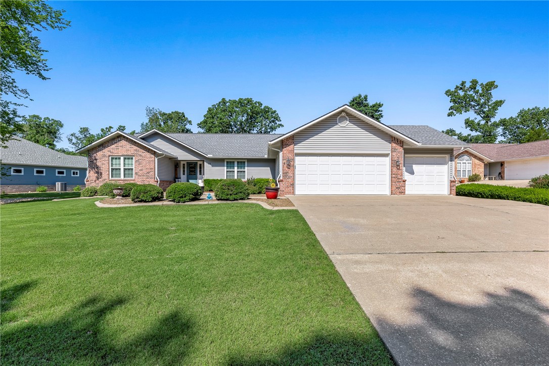 Stunning one level home on the Highlands golf course. The 17th fairway is just outside your back door. Access to I49 (Bella Vista bypass) only 1 mile away. Home is move in ready. Beautiful wood floors, laminet tile in wet areas. Large spacious bedrooms. Granite countertops, breakfast nook and formal dining room. Vaulted ceilings in the living room. Relaxing sunroom . Large master suite. Beautiful outdoor space with covered pergola. Pergola is covered with a rain barrier. 50 amp hot tub connection on patio. 12X14 storage bam. 3 car garage. Level Drive. Irrigation system, Roof was installed 2019 with 30 year shingles. Attic energy shield installed over living area. The Highland Golf course is the home of the Gravette Highschool golf team. Curtains do not convey. Please remove shoes when entering the home or wear provided booties.
