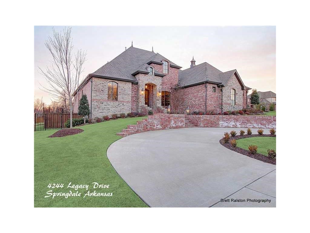 Gorgeous Estate on 2 large lots in prestigious, gated Heritage Hills S/D, 6,700sqft total - 6200sqft of Main Living & Approx 500sqft of Guest Quarters. Featuring one of a kind chef kitchen w/ high end appliances, Scotsman Ice Maker (Sonic Ice), hardwood floors, basement w/ kitchen, bonus room & bath. 2 large bedrooms suites on main level. Enjoy your outdoor living in heated in ground pool & fireplace Minutes from Shiloh and HarBer Schools, Tyson Headquarters, & New Children's Hospital.