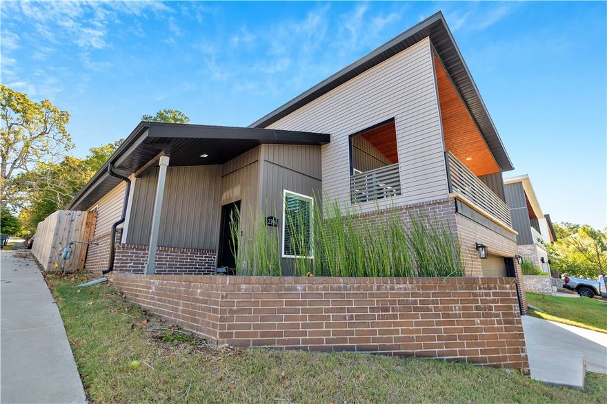 This stunning contemporary home is perfectly situated in the Summit Place subdivision! The expansive covered concrete deck is a standout feature—ideal for relaxing or entertaining while enjoying breathtaking sunset views to the West. The open-concept floor plan offers a spacious primary suite on the main level, complete with a luxurious private bath, walk-in closet, and convenient guest bath. High ceilings and large windows fill the home with natural light, creating a bright and inviting atmosphere. The kitchen is a showpiece, offering modern finishes and seamless flow into the main living areas with beautiful views throughout. The split-level design includes two additional bedrooms connected by a stylish Jack and Jill bathroom. Thoughtful upgrades enhance the home, including a security system, sound wiring, and more. Finishes feature luxury vinyl plank flooring in main areas, cozy carpet in bedrooms, and durable tile in bathrooms and wet spaces. Schedule your showing today.