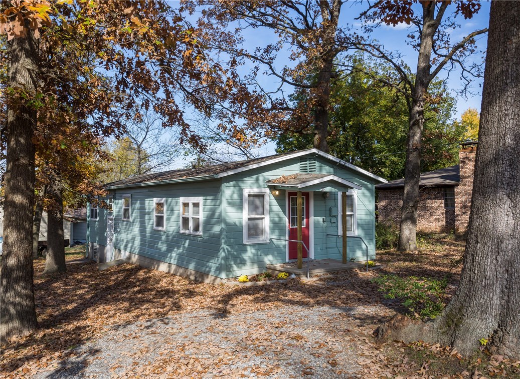 Adorable 3 bedroom, 1 bath, 940sf cottage sitting on just over a quarter of an acre lot with mature trees! New carpet, vinyl flooring & paint. Oak cabinetry in kitchen with built in pantry. Gas connection for range. Walk-in shower in bathroom. Attic fan to help keep house cool in the summer for lower utility bills along with central heat & air. Utility area located in temperature controlled basement with additional storage space not included in SF.