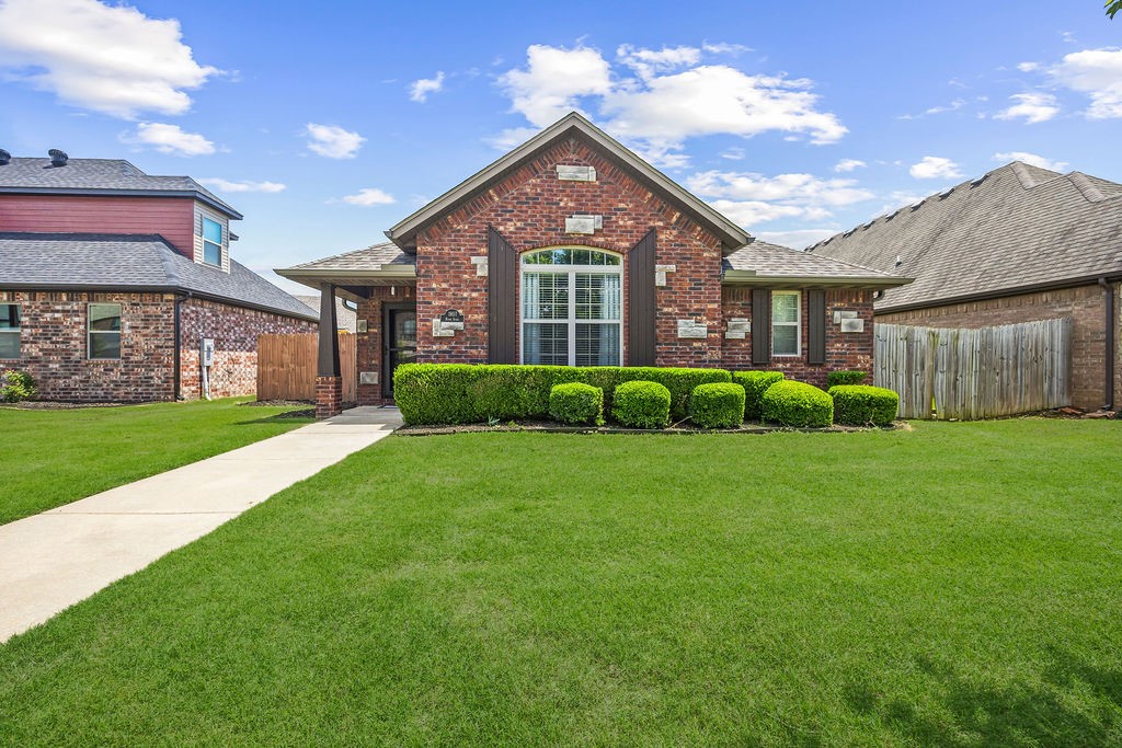 Pristine home in the Stone Meadow Subdivision! Practical open floorplan with vaulted ceilings, wood flooring, and charming electric fireplace providing the perfect place for any family. Delightful eat-in kitchen is equipped with stainless steel appliances, custom cabinetry and wrap around counter with breakfast bar. Separate laundry helps to keep things tidy. Spacious bedrooms with split bedroom floorplan creating functionality for everyone. Fenced backyard and open patio area gives you that dedicated space to unwind from the day. Neighborhood amenities include lawn care and flowerbed maintenance, community pool, fitness room, park and clubhouse. Wonderful location that is moments from all that Bentonville has to offer with easy access to I-49. Close to dining, entertainment, parks and trails. Immaculately maintained and waiting for you!