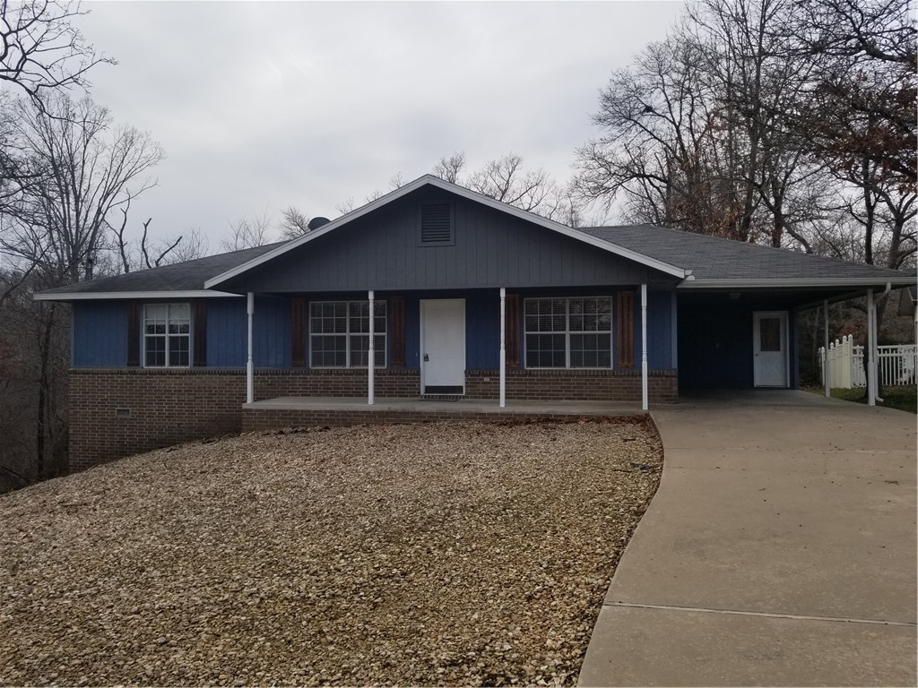 Comfortable home with large, open living room overlooking the deck and back yard. Galley kitchen with dining area. Split bedroom floor plan. Master features a spacious walk in closet. New carpet to be installed in back bedroom. Workshop or extra storage space with exterior access below. Carport of protected parking. Low maintenance rock yard. Great location.
