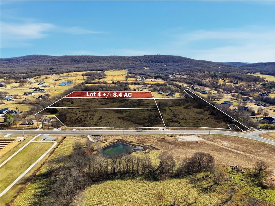 Rare opportunity to acquire prime residential development land in Farmington, AR! This ±8.4 acre lot is positioned in the rear of the parcel, surrounding by trees, and is ideally located across the street from Farmington High School, with Hwy 170 recently expanded and the Farmington School District planning on constructing new facilities across the street. Potential future driveway/easement access will provide convenient access to the lot. Just 2 minutes from Farmington High School and its new $16 million sports complex, this property offers exceptional visibility, access, and long-term growth potential. Zoned RE-1 (Residential Estate District), the land is well-suited for building your dream home. With NWA experiencing rapid growth and developable land in Farmington becoming increasingly scarce, this site presents a rare investment and development opportunity in a highly sought-after location. Secure your place in one of NWA's fastest growing markets and bring your next residential project to life!