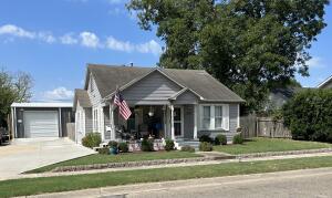 Home, with an accessory dwelling unit w/attached shop!! There are so many possibilities this property has to offer. Located right in the heart of Dardanelle on historic Front St. You could live in the home and enjoy the shop w/living quarters, or use as rental income, or as a home/business as it is zoned commercial.The Accessory unit w/shop was built in 2020 HVAC was installed in 2021. It is fully insulated with 24x50 under roof.10x24 is open patio with a beautiful outdoor limestone fireplace and plumbed for an outdoor kitchen sink 10x24 living area has vaulted ceiling, loft bedroom, full bath w/tiled walk-in shower and stained concrete floors. 30x24 is open shop space w/200-amp power, Tankless water heater, washer and dryer connection, two 10x12 Roll up doors AND a 10k lb. car lift.