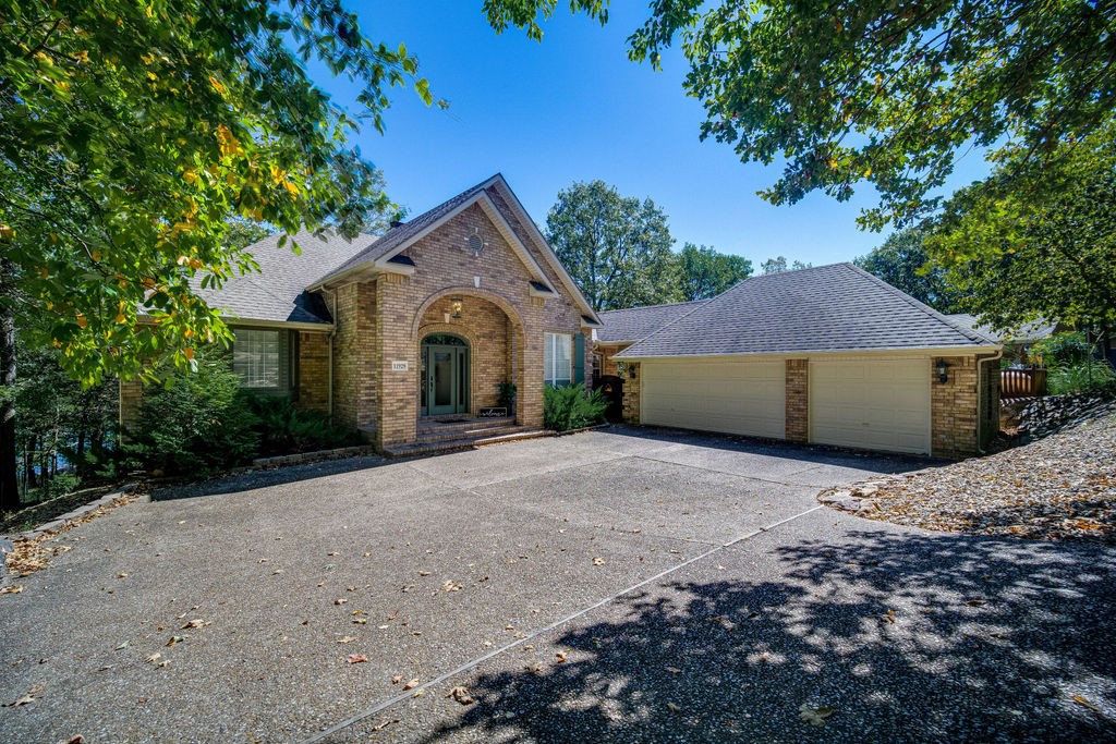 Finns Landing-Beautiful lakefront home, spacious, immaculate, well thought out, and only steps from the clear waters of Beaver Lake. Roast s'mores over the firepit as you relax, unwind and enjoy the outdoors. Professionally landscaped with irrigation for back area, and lots of outdoor living areas for entertaining! Interior has open floor plan, large kitchen with dining. Master bedroom has large picture window to showcase the views of the lake, master bath has updated double vanities with double walk-ins, updated shower. Walk-out basement has second living area which could be a 5th bedroom. New roof in 2015, new 80 gallon water heater in 2021, new GE water softener. This home affords privacy for all of the family and guests! Launch your kayaks out of your back yard and enjoy the clear waters of beautiful Beaver Lake! The home has earned substantial revenue in VRBO rental this year.