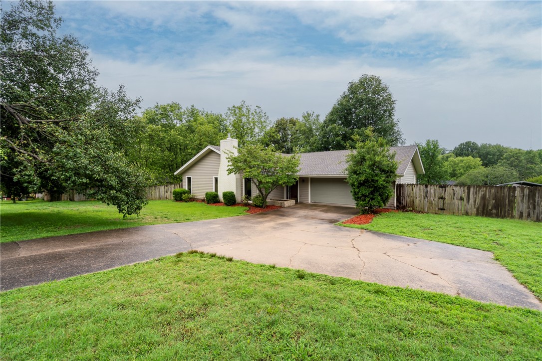 Updated home on 1.7 Acres in Villa View Estates Subdivision. The roof was replaced in 2024, the heat and air replaced in 2023, and a new hot water heater was installed in 2024. The home has new paint and new flooring in Living Room, Hall and Bedrooms. The home has a garden area for those who enjoy gardening. It has stainless steel appliances in the kitchen. This home has an attached 2 car garage, 1 carport, and 1 8'x16' storage building.
