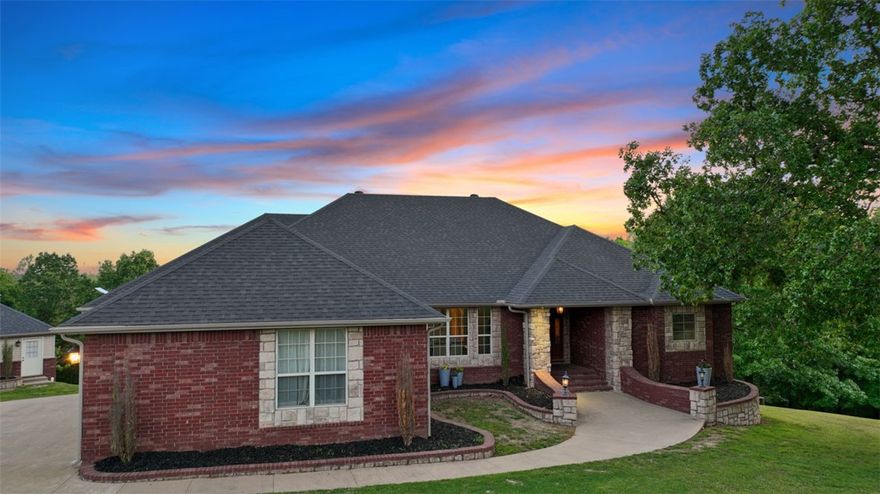 Have your cake and eat it, too! This is 7+ beautiful acres only five miles from the Bentonville Square -
watch the annual fireworks from your pool! The spacious interior boasts three large living areas with a wet
bar, butlers pantry, lovely built-ins, a pellet stove fireplace and gorgeous views from every window. The
kitchen is full of hidden treasures like a tucked away coffee bar and under-cabinet lighting, plus double
ovens. The split-floor plan provides ample privacy in the enormous primary bedroom suite and three large
bedrooms, plus a spacious bonus room with half bath upstairs. Outside is your own private oasis with an
expansive deck, hot tub, 40x20 in-ground pool and patio/pergola, acres of gorgeous woods, fruit trees and
grape arbor, and raised bed garden. Need somewhere to get away and work on hobbies, or perhaps a quiet
home office space? The workshop/detached garage (in addition to the 3-car attached) has it's own
finished space with HVAC, water heater, and full bath. Schedule your tour today!