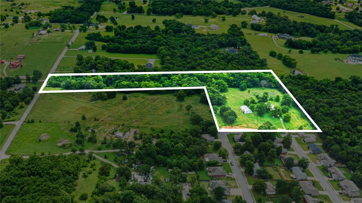 Development potential 4 buildable lots with...Spacious 4-bedroom, 2-bath manufactured home on a permanent foundation with a 2,000 sq. ft. shop. Enjoy open living with plenty of space, a large shop for projects or storage, and room to grow. Located in Cave Springs, this property combines comfortable living with investment opportunity—ideal for a home, hobby farm, or future development