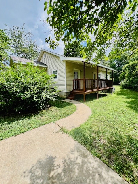 Established trees and landscaping add appeal to this location near downtown Fayetteville and University of Arkansas. Walking distance to the Razorback Greenway, park, farmers market and restaurants. A redwood lined vaulted front entry porch welcomes you to the well maintained 3 br, 2 bath home with 2 spacious living areas with 9ft ceilings, high efficiency windows and quality blinds. Versatile 3rd b.r. may function as an office with exterior entrance. New floor coverings, new paint throughout & new roof in 2025. Kitchen opens to red wood deck for outdoor dining and entertaiing. Paved driveway parking for 2-3 cars. Corner lot with street parking only 1/10 mile to bike trail.