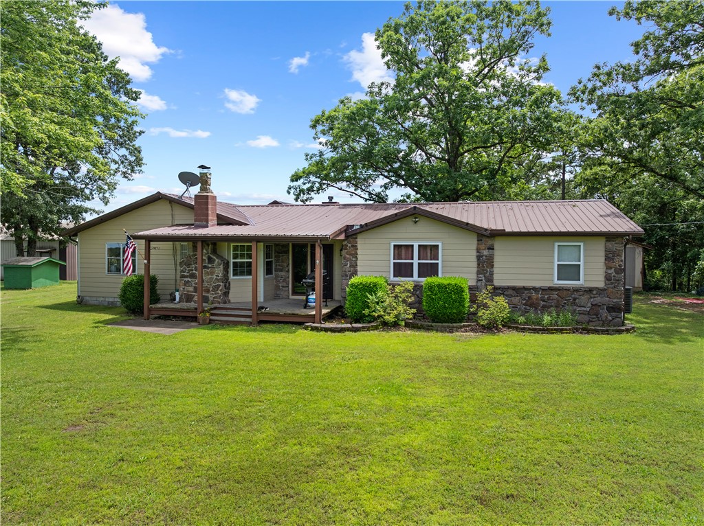Welcome to your private slice of Arkansas paradise! This expansive 3,900 sq ft 4-bedroom, 2-bath home sits on 22.04 beautiful acres and comes complete with a large 1,500 sq ft. metal shop (with power and water available), and a concrete-floored outbuilding. Inside, youāll find bamboo flooring throughout, with tile in the kitchen and bathrooms. Enjoy peace of mind with updated gas lines (Jan 2025) for the backup propane heaters. Step outside to a wraparound deck offers the perfect spot to unwind and enjoy your morning coffee. Towards the back of the property, you'll find a small pond and a cedar hunting stand that conveys. There is also a variety of fruit treesāpeach, pear, apple, fig, plumāas well as grapevines. Every mounted animal in the living room was harvested right on the property. This property is a dream for outdoor lovers and hunters alikeāoffering space, scenery, and true Arkansas charm.