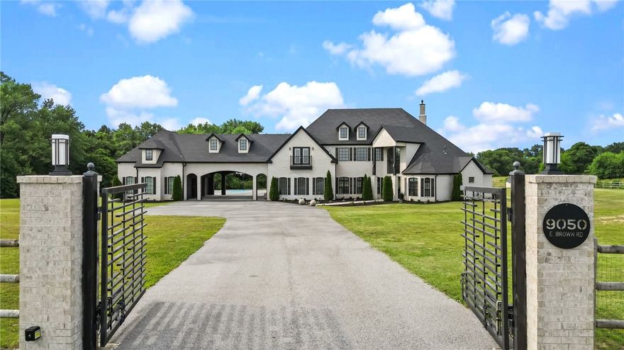 This stunning Estate Home has to be seen to be fully experienced!From the second you pull into the private gated entrance, you’ve arrived at a serene escape with modern features sure to impress. On 3 acres, but close to everything, this gorgeous property offers the luxury amenities of a vacation, with all the comforts of home. The large primary suite is straight out of a magazine—with oversized bedroom and fireplace, enormous walk in closet, and a stunning spa-like bath with incredible stone work. 
Step outside to find endless entertainment options, with a pool, hot tub, and sports court like your own little resort. The newest addition to the home—an enormous covered patio with fireplace and kitchen—complete the luxurious outdoor experience. The home features a number of other amenities you'd want in your dream home, including a chefs kitchen, formal dining room, theatre room, home office, wet bar with wine fridge, bonus room, and a (gym with an additional 947 sq ft that will be priced as separate square footage)