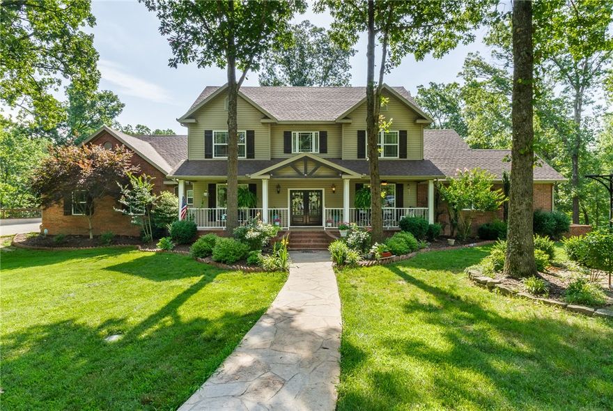 Amazing Estate home sitting on 13 acres. Only five minutes from the planned Walmart campus, even less to I49! This amazing property features 2 outbuildings to handle all your business and/or hobby needs.  Home also features a swimming pool and fenced acreage for your livestock or hobby farm. Beautiful hardwood floors & trim. Cathedral windows & vaulted ceilings. Spacious master suite has spa-like attached bath w/ walk-in shower and tub. Large walk-in closet in master. All bedrooms have private baths. Downstairs is a dream for entertaining with built-in wet bar. High-end finishes & features throughout. **Detached buildings include 80x50 cooled shop with 14 ft side walls and a 36x36 Pool house/Outbuilding with 12 foot overhang.