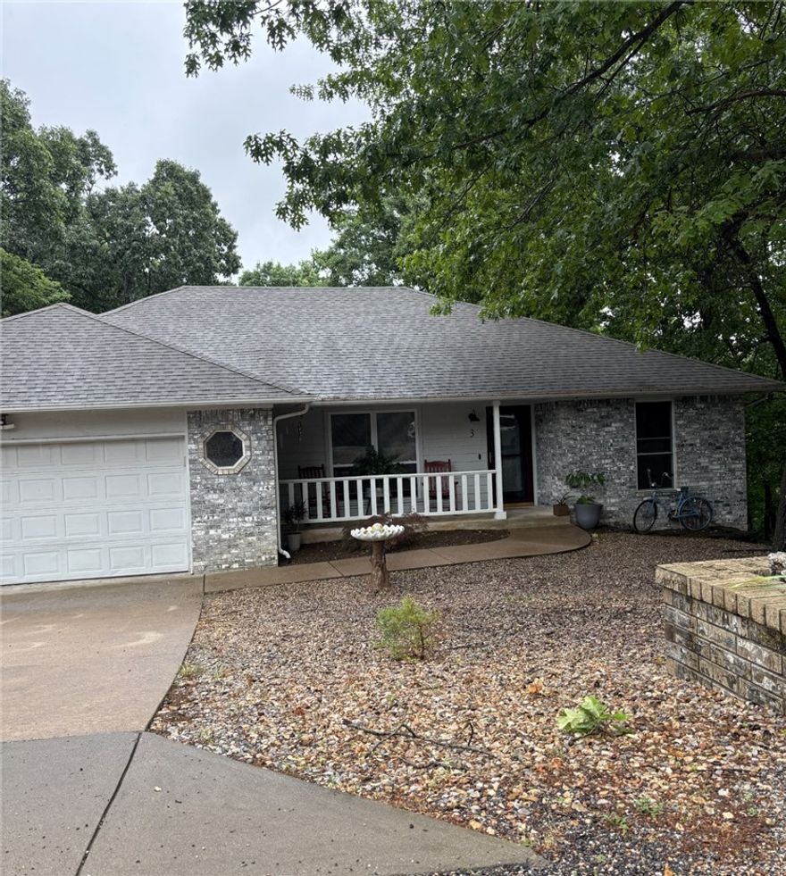 This home is conveniently located just W. of Forest Hills.  Enter with a large roomy living area w/cathedral ceiling,(recently painted ceiling & walls).  Large island kitchen with walls of cabinets and ample room for a good size dining.
This split floor plan has the laundry tucked at the end of the hall just off of the primary suite.  The back covered patio leads down to a lower level 594' specialty room.  This versatile area is heated & cooled with 1/2 bath, windows and walk in entry for shop, crafts, extended living... (not included in the upper living sq. ft.)