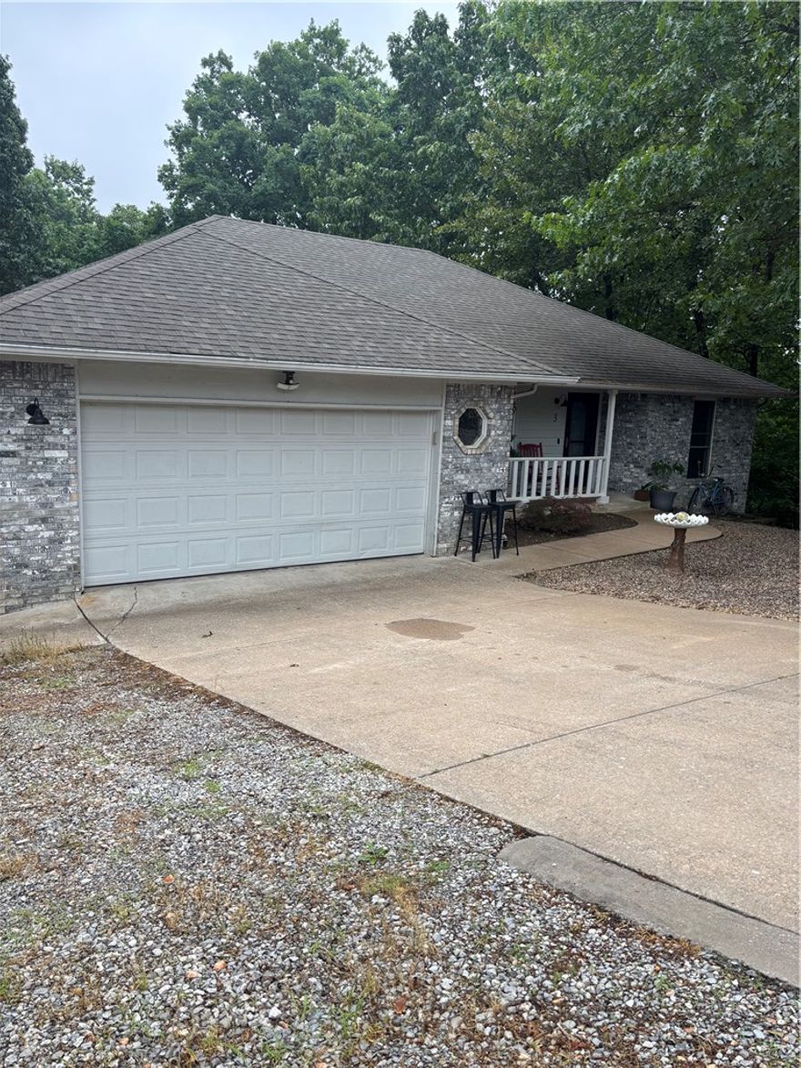 This home is conveniently located just W. of Forest Hills.  Enter with a large roomy living area w/cathedral ceiling,(recently painted ceiling & walls).  Large island kitchen with walls of cabinets and ample room for a good size dining.
This split floor plan has the laundry tucked at the end of the hall just off of the primary suite.  The back covered patio leads down to a lower level 594' specialty room.  This versatile area is heated & cooled with 1/2 bath, windows and walk in entry for shop, crafts, extended living... (not included in the upper living sq. ft.)