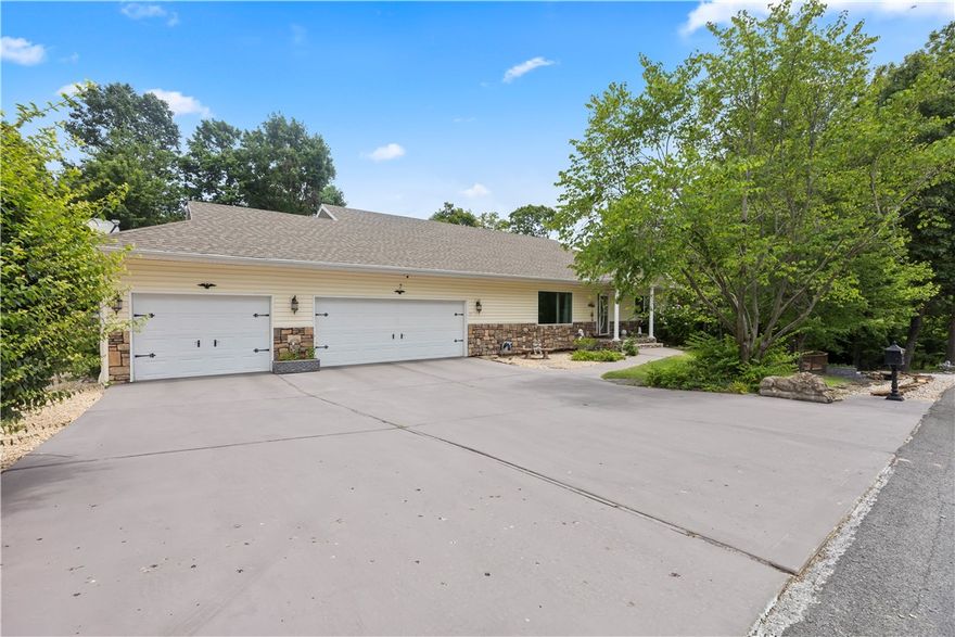 This home has it all! looking for all the extras? Look no further. Featuring 3 car oversized garage & a 3 car tandem garage basement level with easy access to for 6 GARAGE SPOTS TOTAL! 2 level lots for total of .78 acres, full 1 bedroom apartment with separate entrance, workshop in basement with 2 drains & has true RV parking with privacy fence. Builders do not build homes like this any longer with 2x6 framing for solid home & 2–1000-gallon septic tanks & real hardwood flooring, crown molding & double hung windows. Home features 3 bedroom & 3 bathrooms total with bonus/craft room could be 4th bedroom. New paint throughout the home as well as kitchen & bathroom cabinets. New hardware in kitchen, new lighting in dining room & living room. Enjoy summer with above ground pool. 20x18 back deck built to support hot tub/with 110 & 220 outlet. Must see to appreciate all this has to offer for a car collector, boat storage or storage for RV!