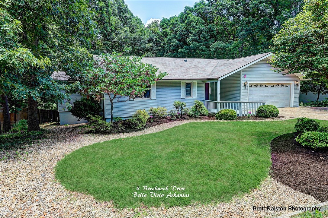 The roof was new in 2007. Many current updates including new counter tops,SS appliances and new toilets. Freshly painted throughout. new lights. Whole house fan, very functional radiant heat, plus propane fireplace in the living room. central air/heat and ceiling fans. Great master bath, new sinks and faucets Lovely screened in sun room & open decks to wooded views. New laminate and tile flooring Landscape sprinklers. A great Package and Great value..