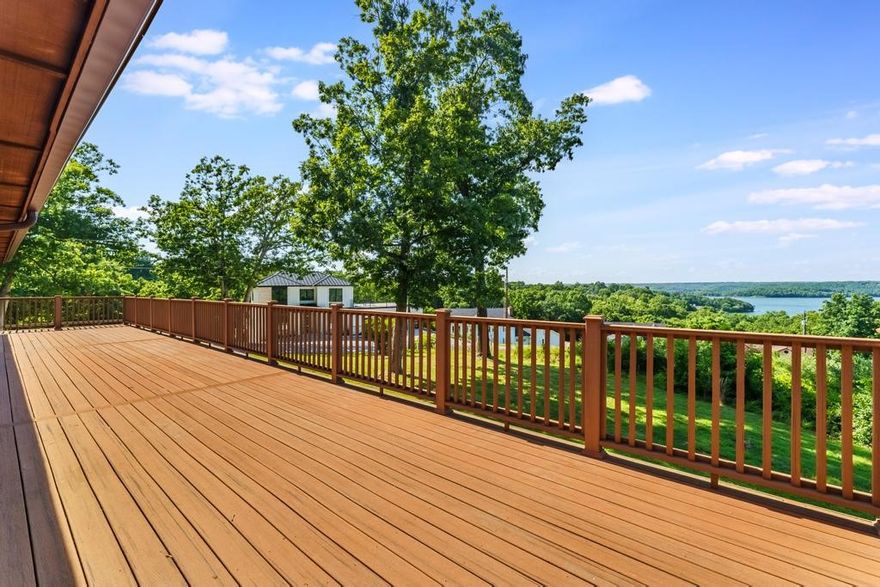 AMAZING location with year-round views of Beaver Lake! This single level, all brick home sits on a large, fairly flat, corner lot, just under a full acre. Beautiful views of Beaver Lake can be seen from the expansive deck, living room, sunroom & primary bedroom. The low maintenance composite deck can be accessed from the double sliders in the living room or from the sunroom. This home has been meticulously cared for by the same owners for the past 39 years. The kitchen has original features and is ready for you to update and customize. Natural light pours in thru the large front windows along the foyer hallway. All brick wood burning fireplace is at the heart of the living room. Oversized 2-car garage with room for storage & expanded driveway. Located less than a mile to Hwy 12 & 4 miles to Prairie Creek Marina. Roof was replaced 7-10 yrs ago. Recent updates: new heat pump (3 yrs), new toilets (5 yrs), shutters (3 yrs), wood flooring, sliding windows in back & composite deck.