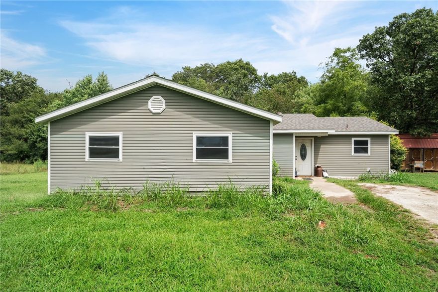 This 3-bedroom, 2-bath home sits on 3.29 acres and gives you the space you’ve been craving—inside and out. Step into the open living, dining, and kitchen area where everything flows together, anchored by a kitchen with plenty of cabinets and workspace. The bedrooms aren’t just “bedrooms”—they’re generously sized with plenty of room to relax, and the bathrooms actually have room to move.

Outside, a concrete deck is ready for grilling, gathering, or winding down after a long day. You’ll also find a well house and a storage building—practical features that keep the rest of your home clutter-free. And with over three acres to spread out on, you can bring your projects, hobbies, or animals and still have room left over.

If you’ve been waiting for a place that feels wide open and truly your own, this one’s it.
**This property is being sold as-is.**