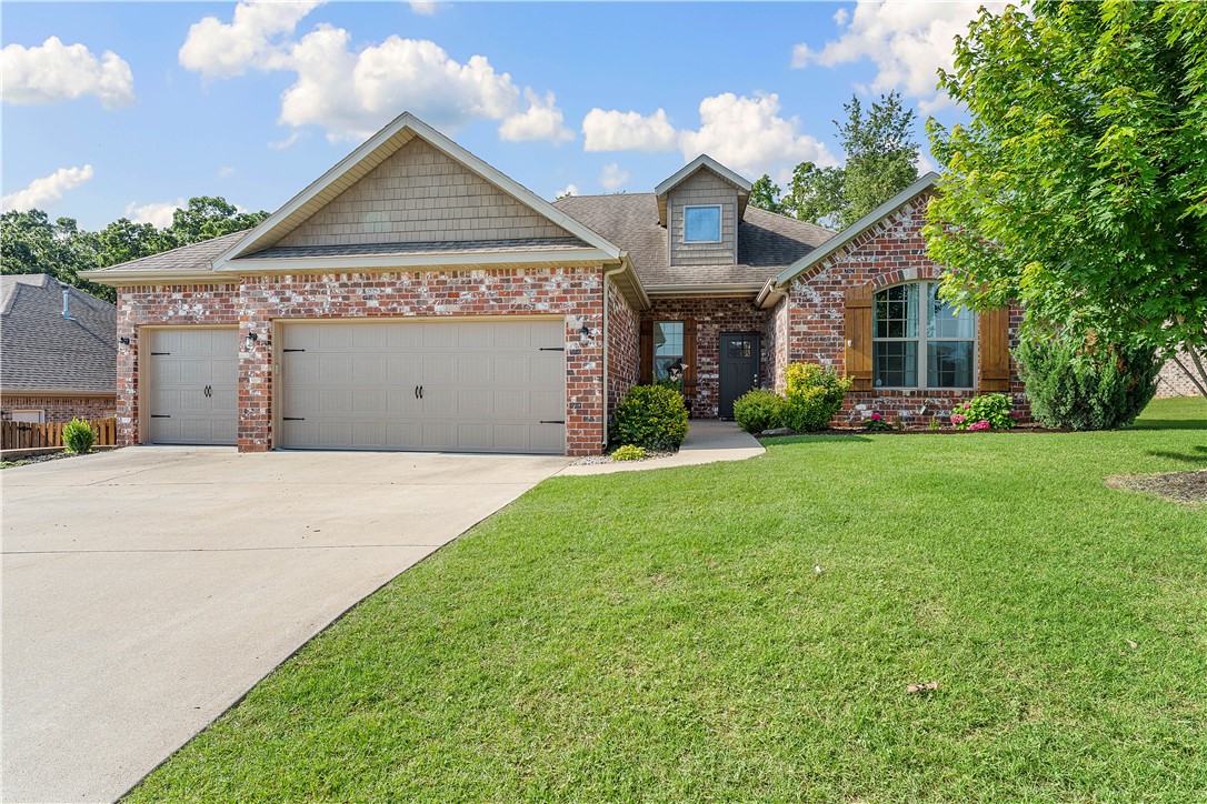 Open floor plan in the fabulous Tamarron Subdivision. 4 bedrooms, 2 bathrooms, 3 car garage, hardwood floors, Kitchen with 3cm granite countertops, custom floor to ceiling built in shelving & cabinets in formal dining or flex space, gas range, pantry, Family room has gas fireplace with vaulted ceiling. Backyard oasis with 3-teir outdoor living space with the lower level is a flagstone patio. Yard backs to woods adding additional privacy. Both front and back yard are landscaped. Home built by Dave Marrs