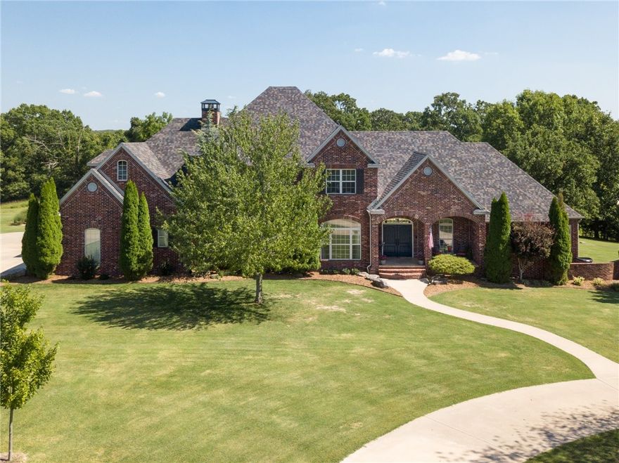 Beautiful executive family home located on 3.29 acres in a quiet rural subdivision and only 12 minutes to downtown Bentonville.  Close to trails, shopping and dining.  This 6 BR 4.5 bath custom home has everything including gorgeous views, huge kitchen with granite counters, main floor in-law suite, built ins, wired for surround sound, game/media room, Etc.  This home welcomes you to a peaceful backyard oasis with covered patio overlooking the pool and still allows plenty of room to build a stable.   New roof and newly renovated pool in Aug 2021
