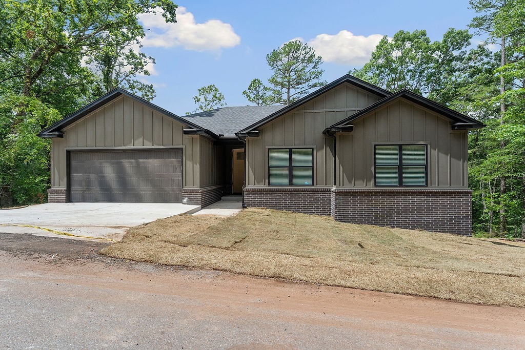 Come see this fantastic new construction home with a one year builder's warranty! This is a true 3 bedroom home on city sewer and not septic, and, unlike most new builds, this home comes with a propane tank installed. Located on the East side of Hwy 71 there is easy access to downtown Bentonville (which is 10 miles away) and all the biking trails. There is so much to love about this home: The inviting, contemporary exterior with dark roof, windows and gutter lead into the crisp, clean, contemporary aesthetic of the interior. With fabulous storage and intentional use of space, the home has a great pantry, utility room and lots of storage in closets and attic space. A gently sloping back yard allows for privacy to enjoy nature on the back deck. Be a part of the thriving biking community in Northwest Arkansas and enjoy all the amenities that Bella Vista has to offer with it's golf courses, hiking, bike trails, clubhouse, swimming pools and lakes.