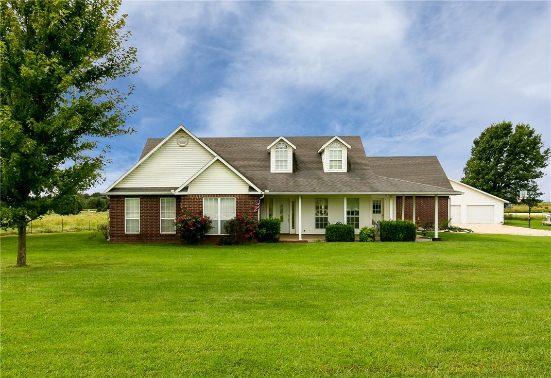 Country living at this best. This lovely home boasts a split floor plan, walk in closets, stainless appliances, gas log fireplace, a large bonus room that could be a 4th bedroom and so much more. The 3 car garage is insulated, with a full bath. Let's not over look the covered porches that you will enjoy coffee in the mornings and sunsets in the evening from. All this on an acre of land.