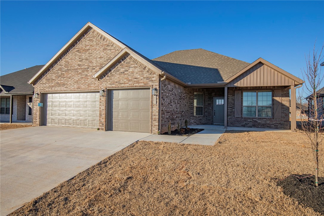 NEW CONSTRUCTION SPECIAL!!! 1/2 of a month rent free at the start of your lease!!! Come checkout this gorgeous home that features 4 bedrooms, 2 baths and 3 car garage. Beautifully stained custom cabinetry, gas range, and quartz countertops in the kitchen. Wood look tile throughout for easy cleaning and hypoallergenic. Primary suite features huge pass through walk-in closet with access to oversized laundry/mudroom area equipped with built-in coat rack and bench. Primary suite bathroom has large walk-in tiled shower, garden tub, dual vanity, and water closet. Large fenced in yard for the kids or dog to run around the yard while you enjoy sitting on the covered back patio. Home located within a quick drive to airport, Walmart Headquarters, Downtown Bentonville square, or endless miles of mountain biking trails.