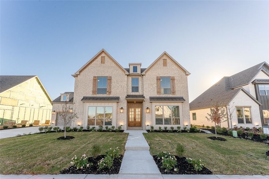 This stunning 2-story Hamilton plan offers a blend of elegance & comfort. As you enter, you're welcomed by an open, spacious layout featuring 12-foot ceilings in the living room, kitchen, & dining. The living room is a true centerpiece, boasting a striking 12-foot shiplap fireplace with an accent beam & large picture windows that flood the space with natural light. The living area flows seamlessly into the designer kitchen, perfect for entertaining, with floor-to-ceiling cabinets, quartz countertops, & an enlarged island with extra storage. Off the living room, you'll find an extended patio with a vaulted ceiling, ideal for outdoor gatherings. The downstairs owner’s retreat is generously sized, complete with a luxurious bath & walk-in closet. Upstairs, there’s a versatile loft area, along with 2 additional bedrooms & a full bath. The garage is thoughtfully designed, providing space to park on one side while leaving the other side free to use how you choose.