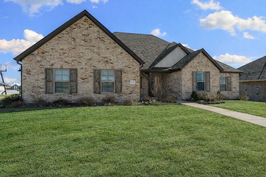 Experience modern luxury in the highly desirable South Pointe subdivision! This stunning 2020-built, all-brick home sits on a spacious 0.31-acre corner lot and features an expansive 3-car garage. Inside, you’ll find a bright, open-concept floor plan with tall cathedral ceilings, crown molding, and beautiful wood flooring. The gourmet kitchen is a chef’s dream, complete with granite countertops, custom cabinetry, a gas range, and a large walk-in pantry.

Originally designed as a 5-bedroom, two main-floor rooms were professionally combined into one massive suite, though it can easily be converted back to suit your needs.

Outdoor living is a breeze with a covered back patio that includes a pergola with a privacy wall, privacy fencing, and professional landscaping. Enjoy neighborhood amenities including a community pool, pavilion, and playgrounds. Perfectly located just minutes from I-49, Arvest Ballpark, Tontitown Winery, and Arkansas Children’s Hospital NW. Welcome home!